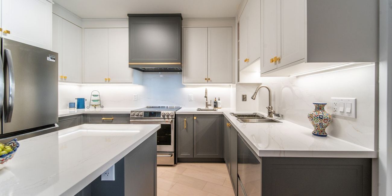 Kosher kitchen renovation. Two tone transitional painted MDF and quartz countertop and backsplash. Design and build by JK