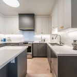Kosher kitchen renovation. Two tone transitional painted MDF and quartz countertop and backsplash. Design and build by JK