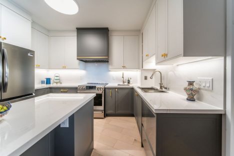Kosher kitchen renovation. Two tone transitional painted MDF and quartz countertop and backsplash. Design and build by JK