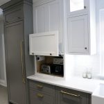 Lift up kitchen cabinet. Designed to hide small appliences. By JK Markham