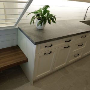 Lundry room cabinets. Custom made painted off white cabinets. Ceaserstone concrete counter top. Design and build by Joseph Kitchen and bath Markham