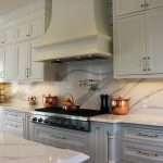 Classical kitchen design. Solid wood framed kitchen cabinets. Bell shaped mantel hood. Design and build by JK 2019 Markham