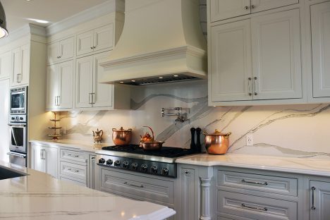 Classical kitchen design. Solid wood framed kitchen cabinets. Bell shaped mantel hood. Design and build by JK 2019 Markham