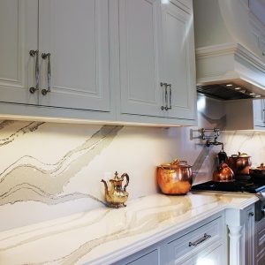 Kitchen design and renovation. Luxury painted white kitchen. Custom design framed kitchen cabinets. Bell shape custom made insert hood. white and gray from marble collection- Britannica from Cambria. North York. 2019