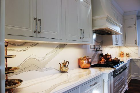 Kitchen design and renovation. Luxury painted white kitchen. Custom design framed kitchen cabinets. Bell shape custom made insert hood. white and gray from marble collection- Britannica from Cambria. North York. 2019