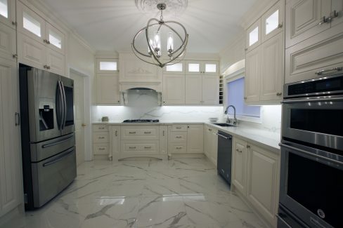 Full kitchen renovation. Design and build by JK. Painted off white kitchen cabinets. Double stack cabinets. Built in appliances. Toronto 2019