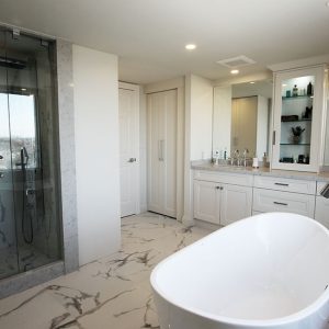 Master bedroom total bathroom make over. Double sink vanity with quartz counter top. Free stand bathtub. White and gray modern bathroom. Design and built by Joseph Kitchen Toronto 2019.