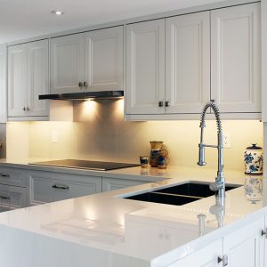 Total itchen make over. Custom made kitchen cabients off white painted kitchen cabinets. Water fall island from Geolux Design and built by Joseph Kitchen North York