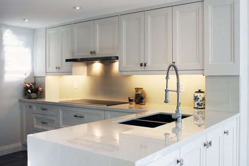 Total itchen make over. Custom made kitchen cabients off white painted kitchen cabinets. Water fall island from Geolux Design and built by Joseph Kitchen North York