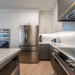 Transitional two tone kitchen. Painted MDF white and gray kitchen cabients. Full renovation by JK including floor, cabinets, countertops. Markham