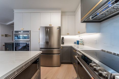 Transitional two tone kitchen. Painted MDF white and gray kitchen cabients. Full renovation by JK including floor, cabinets, countertops. Markham