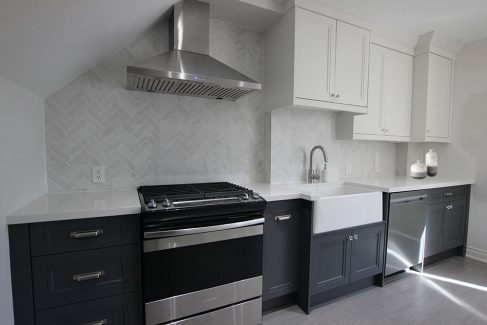 Two tone kitchen cabinets. Gray and white kitchen. Design and build by JK. Toronto 2019