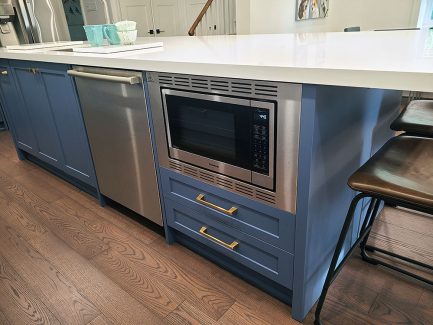 White and blue modern island Painted MDF Built in microwave sink on the islad construction and renovation by Joseph kitchen and bath