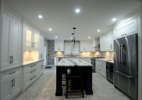 High-end, custom made contemporary solid wood kitchen. All doors are inside a fame. Painted in off white with Benjamin more colors. Island is solid wood stained to dark brown. Designed and built by JK 2017 Richmond Hill.