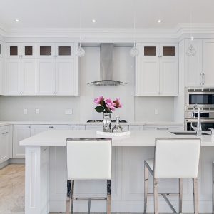 Double stack painted kitchen. Large island. White quartz counter top. Built in appliances. North York 2017