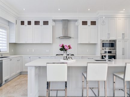 Double stack painted kitchen. Large island. White quartz counter top. Built in appliances. North York 2017