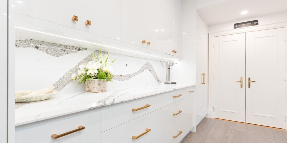 usersFfed afe da afffacdFlibraryFacd d a aa ffebFA Edit A sleek European modern kitchen with handleless, flat-panel cabinets in a matte white finish, a large marble island, and integrated high-end appliances, reflecting the sophisticated style popular in Toronto homes.
