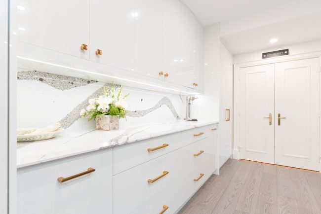 usersFfed afe da afffacdFlibraryFacd d a aa ffebFA Edit A sleek European modern kitchen with handleless, flat-panel cabinets in a matte white finish, a large marble island, and integrated high-end appliances, reflecting the sophisticated style popular in Toronto homes.