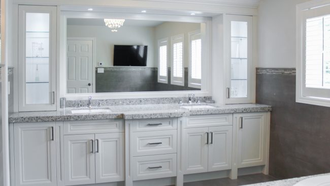 usersFfed afe da afffacdFlibraryFfed fa b b cfbabfF FullyrenovatedbathroomCdoublesinkvanityCoffwhitepaint A modern white bathroom vanity with double sinks and a large mirror.