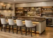 Modern custom wet bar with wood cabinetry, stone countertop, wine fridge, open shelving, glassware, and upholstered counter stools.